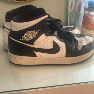 Half white half black Nike air jordan’s